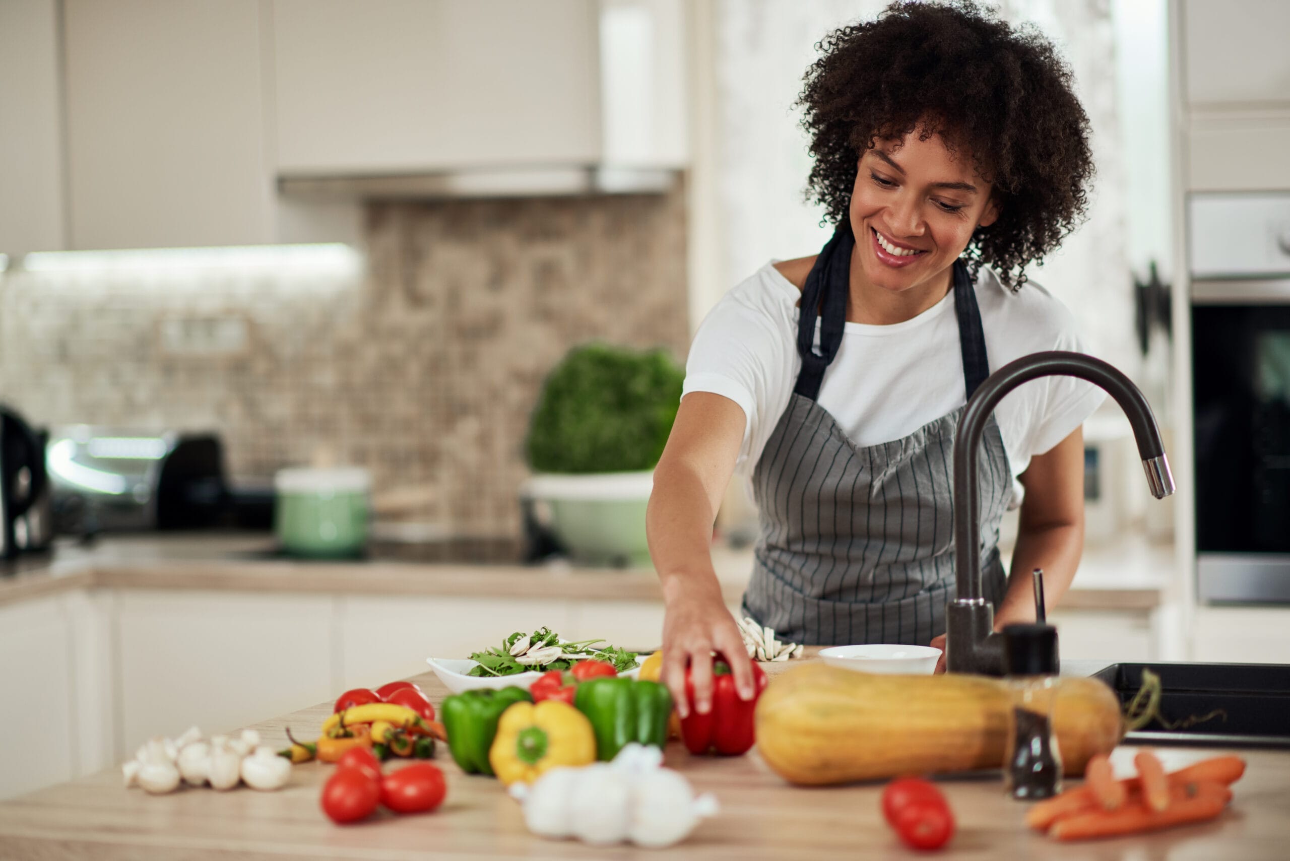 woman preps health meal for balanced nutrition